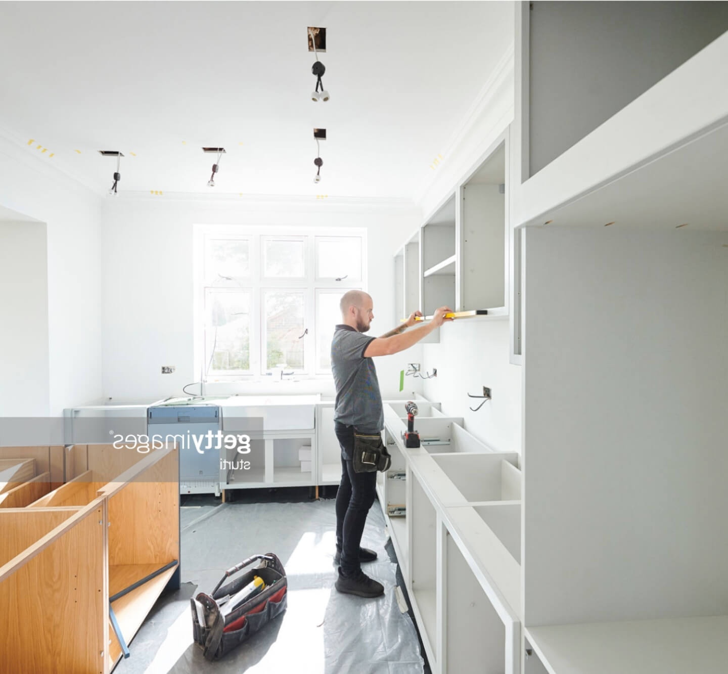 Man mounting cabinet